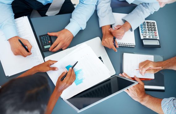 Cropped image of hands of businesspeople working together on business project at office - Consulting